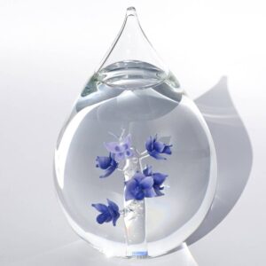 Glazen asdruppel paarse orchideetjes met vlinder